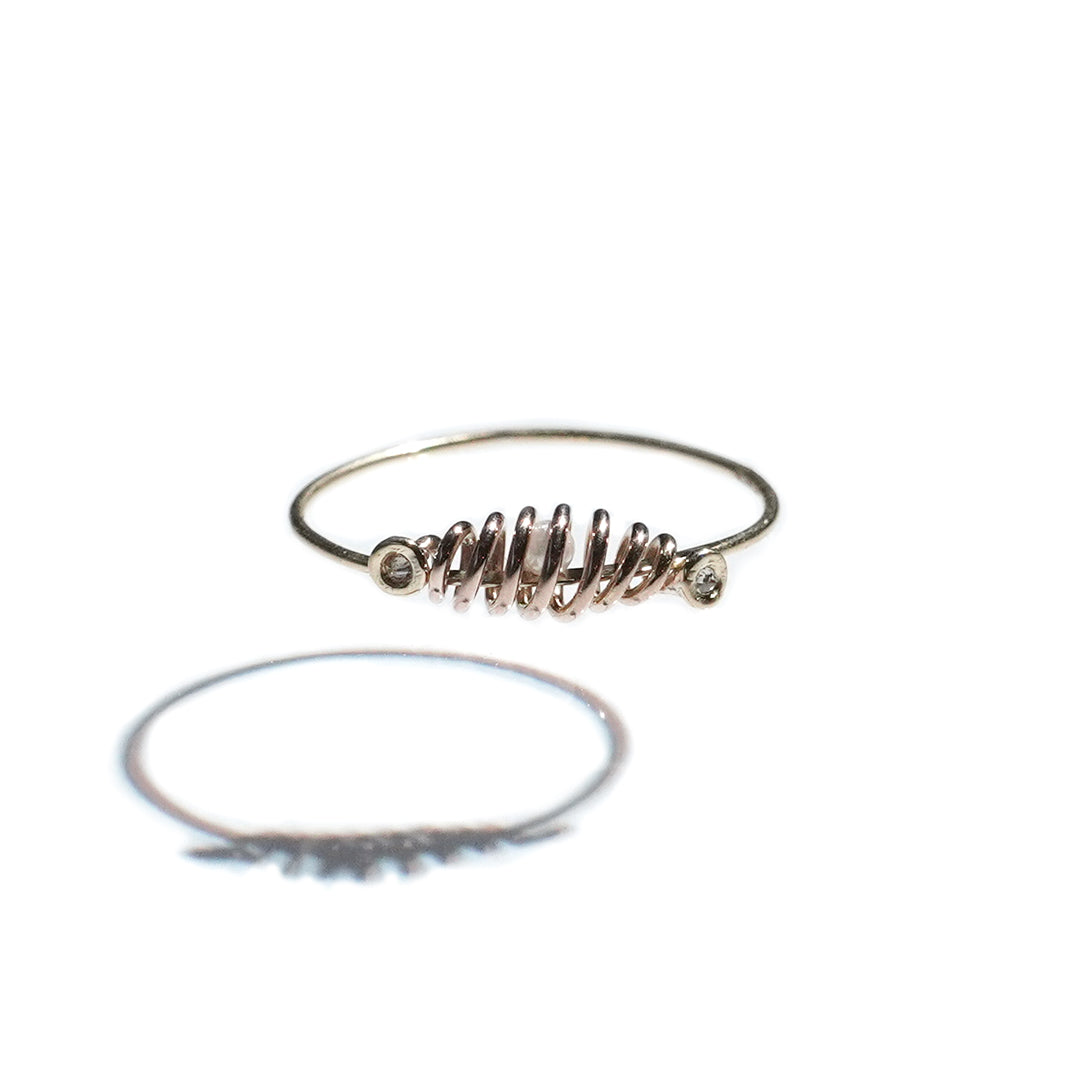 coil ring with dia meet akoya
